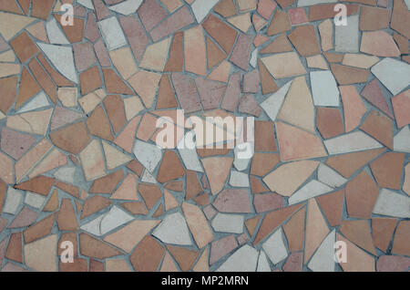 Background of brown and white mosaic tiles in a pattern. Pastel beige tile texture. Stock Photo