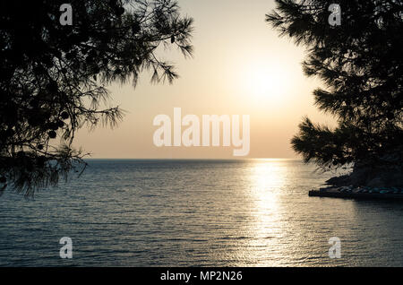 Beautiful sunset view on sea and Stadi Grad - old town of Ulcinj at twilight scene. Coast of Adriatic sea. Montenegro. Stock Photo