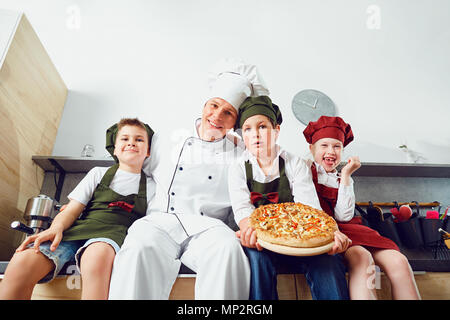 Children learn to cook in the classroom in the kitchen Stock Photo