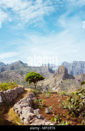 Hiking trail leading through arid rocky terrain towards Caculli village on Santo Antao Cape Verde Stock Photo