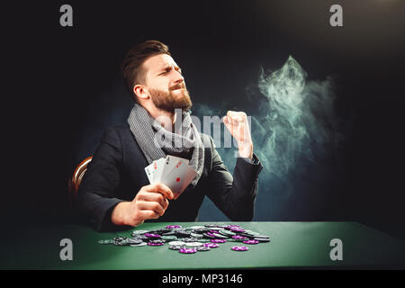 Pocker player with cards win the game Stock Photo