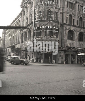 1963, historical picture of London's West End, showing the exterior of the Strand Theatre at the Aldwych, which is staging, 'A Funny Thing Happened on the Way to the Forum', a vaudeville musical comedy by American composer and lyricist Stephen Sondheim, starring British actor and comedian Frankie Howerd. The musical was a big hit and ran for nearly two years. Stock Photo