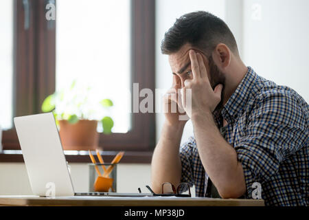 Concerned male thinking about problem solution Stock Photo
