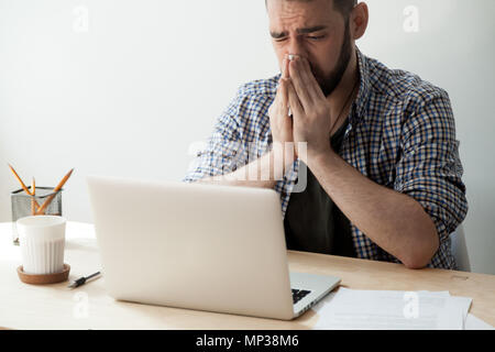 Ill man suffering from congestion and fever Stock Photo