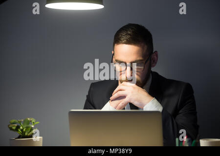 Concerned male thinking about company problem solution Stock Photo