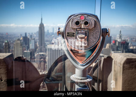 Iconic coin-operated telescope at Top of the Rock observation deck in New York City, USA. Stock Photo