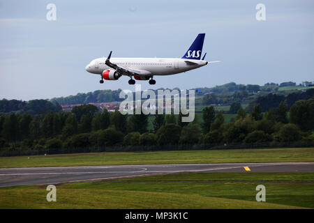 A Scandinavian airlines system plane comes in to land at Edinburgh airport Stock Photo