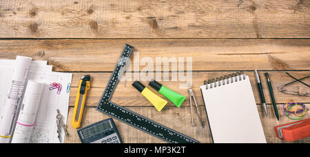 Architect workplace top view. Project construction blueprints and engineering tools on wooden desk, copy space Stock Photo