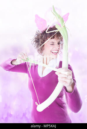 Amure cupidon with bow and arrow in pink clouds Stock Photo