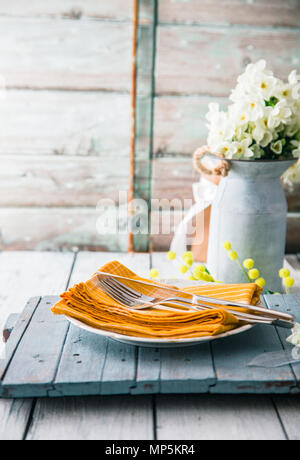 Spring table setting. Narcissus flower. Spring flowers Stock Photo