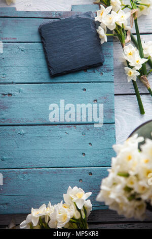Spring table setting. Narcissus flower. Spring flowers Stock Photo