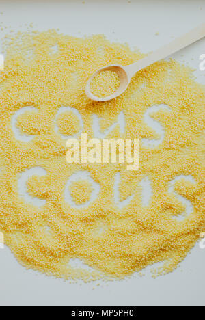 Raw cous cous background on white background Stock Photo