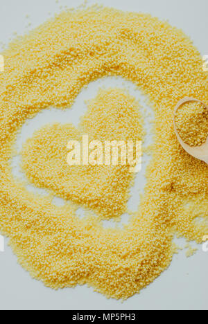 Raw cous cous background on white background Stock Photo