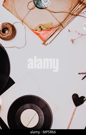 Stack of scratched dusty old vinyl records tied with rope Stock Photo