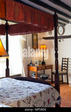Large traditional style bedroom with a four poster bed Stock Photo
