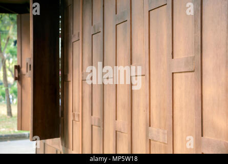 View of wooden wall of ancient thai style house. Stock Photo