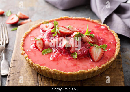 Yogurt tart with rhubarb strawberry compote Stock Photo
