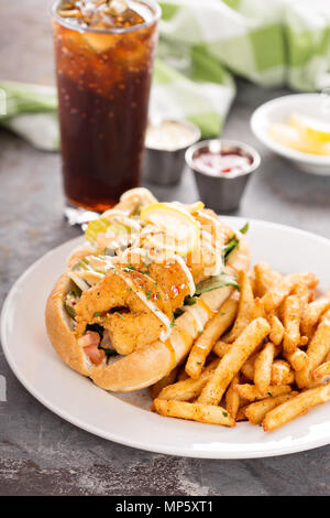 Shrimp po boy sandwich with fries Stock Photo