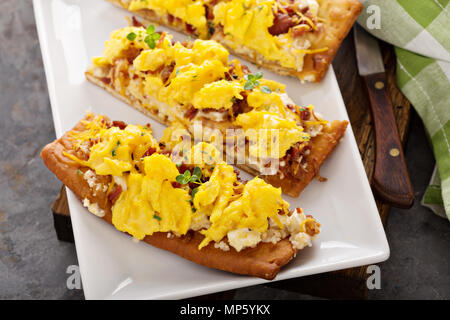 Breakfast pizza, flatbread with scrambled eggs Stock Photo