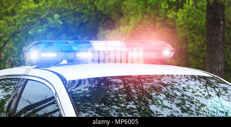 Police sirens in operation. Blue and red flash lights of emergency car in action. Police crew with the siren lights on emergency alert. Stock Photo