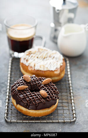 Chocolate and almond donuts with coffee Stock Photo