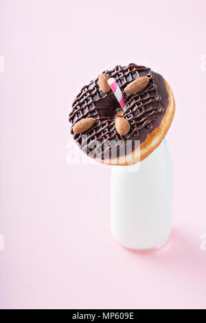 Chocolate almond donut with a bottle of milk Stock Photo