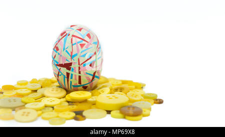 isolated happy easter, colorful easter egg standing on the yellow button, easter holiday decorations, easter concept backgrounds Stock Photo