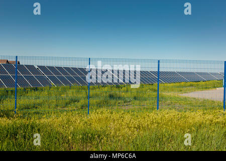 Grin clean electric power - Solar panel outside on grass field photo-voltaic Stock Photo