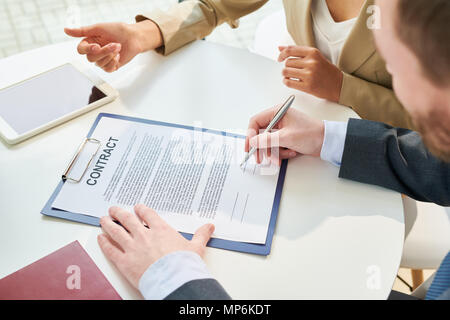 Unrecognizable Businessman Signing Contract Top View Stock Photo