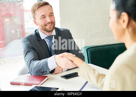 Handsome Businessman Shaking Hands with Partner Stock Photo