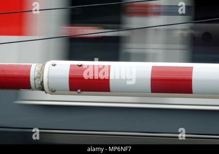 fast train passing level crossing gate Stock Photo