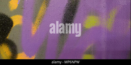 Colorful graffiti painting fragment on plaster wall. Stock Photo