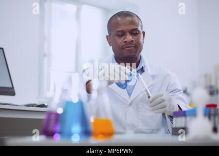 Smart scientist doing an important test Stock Photo