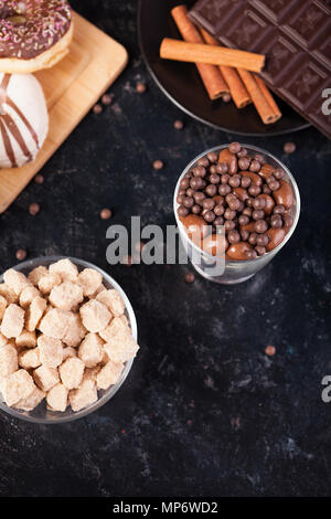 Chocolate tablet next to other candies Stock Photo