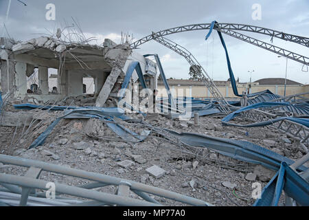 Sanaa, Yemen. 21st May, 2018. A Yemeni man inspects a destroyed petrol station after it was targeted by Saudi-led airstrikes on the outskirts of Sanaa, Yemen, 21 May 2018. Credit: Hani Al-Ansi/dpa/Alamy Live News Stock Photo