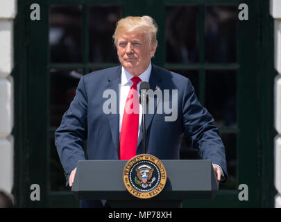 Washington, USA. 21st May, 2018. United States President Donald J. Trump makes remarks as he hosts Martin Truex Jr., the NASCAR Cup Series champion, and his team, on the South Lawn of the White House in Washington, DC on Monday, May 21, 2018. Truex competes full-time in the Monster Energy NASCAR Cup Series for Furniture Row Racing. Credit: Ron Sachs/CNP /MediaPunch Credit: MediaPunch Inc/Alamy Live News Stock Photo