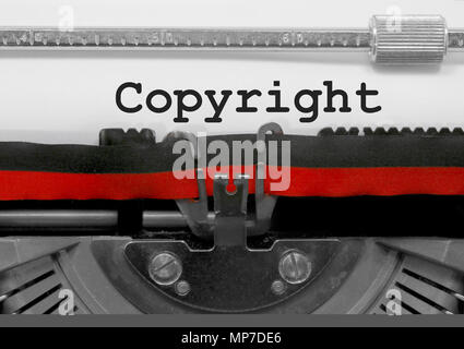 Copyright text written by an old typewriter on white sheet Stock Photo