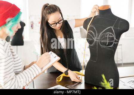 Two Creative Young Women Working in Atelier