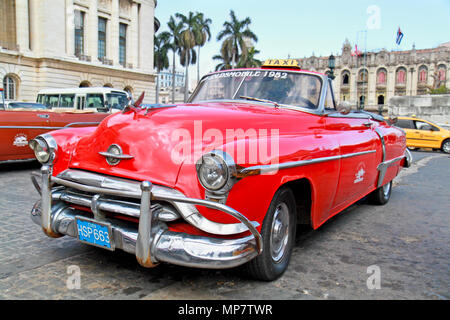 HAVANA-FEB 3:Classic Oldsmobile waiting for tourists on February 3; 2010 in Havana.Thousands of these vintage cars are in use in Cuba and have become  Stock Photo