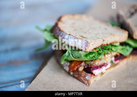 Delicious artisinal sandwich of mixed vegetables on a wooden table Stock Photo