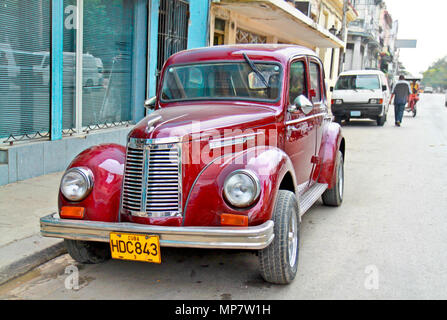 HAVANA-FEBRUARY 4:Classic american cars February 4, 2010 in Havana.Before a new law issued on October 2011,cubans could only trade old cars that were  Stock Photo