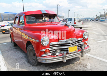 Classic red Plymouth in Havana. Cuba. Under current law that the government plans to change before 2012,Cubans can only buy and sell cars that were in Stock Photo