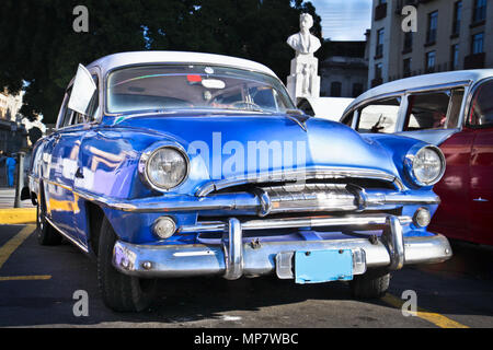 HAVANA-JANUARY 8:Classic blue Plymouth on Jan 8, 2010,Havana.Under current law that the government plans to change before 2012,Cubans can only buy and Stock Photo