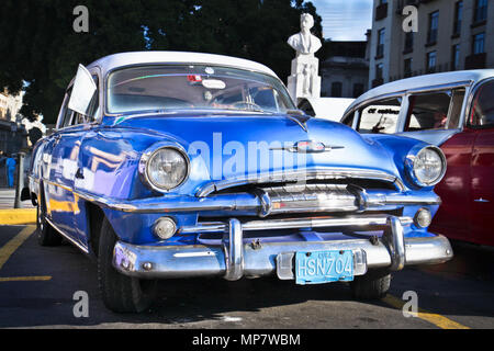 HAVANA-JANUARY 8:Classic blue Plymouth on Jan 8, 2010,Havana.Under current law that the government plans to change before 2012,Cubans can only buy and Stock Photo