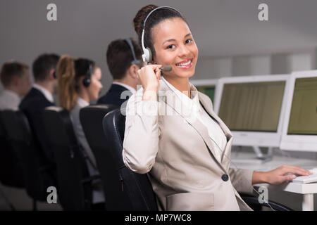 Young telemarketer during her job Stock Photo