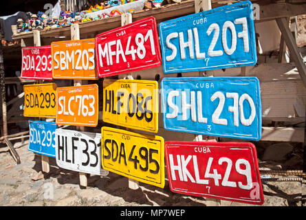 Traditional handcrafted vehicle registration plates like souvenirs for sale in Trinidad, Cuba. Stock Photo