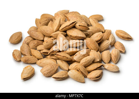 Heap of fresh unpeeled almonds isolated on white background Stock Photo
