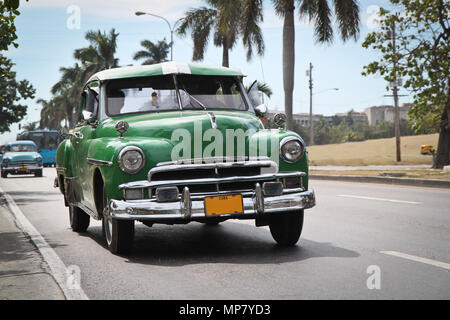 HAVANA-JANUARY 8:Classic green Plymouth on Jan 8, 2010,Havana.Under current law that the government plans to change before 2012,Cubans can only buy an Stock Photo