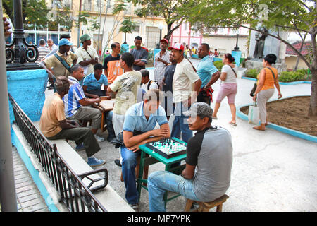 SANTIAGO DE CUBA, CUBA- JANUARY 21: People play the chess on central square on January 21 . 2010. in Santiago de Cuba.  The central Santiago de Cuba's Stock Photo