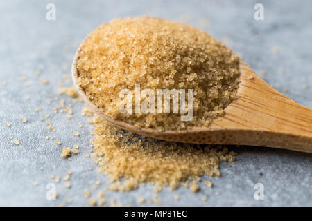 Brown Sugar in Wooden Spoon with Package. Organic Food. Stock Photo